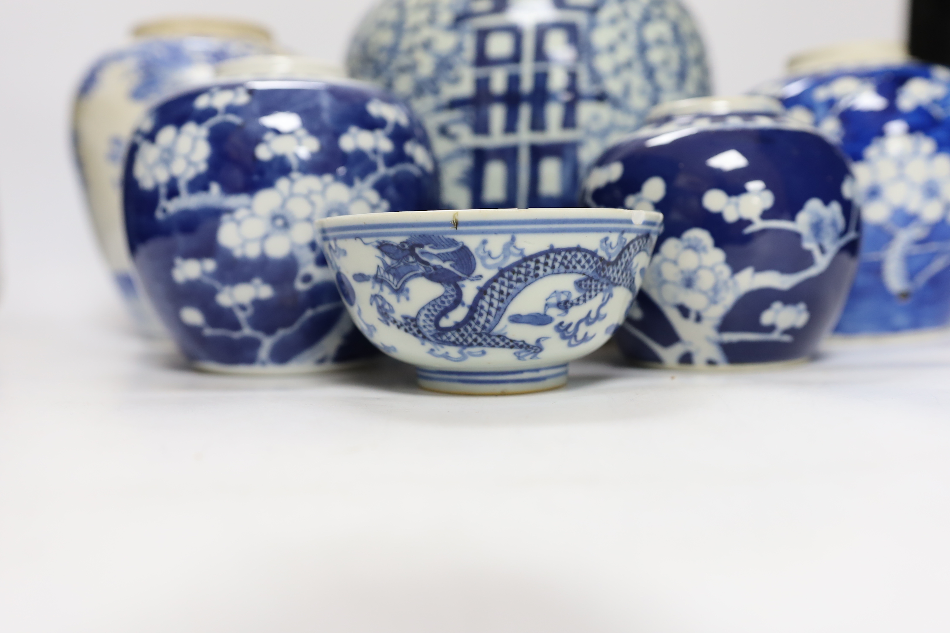 A group of four Chinese blue and white jars and a bowl, together with a similar Japanese jar, tallest 21cm